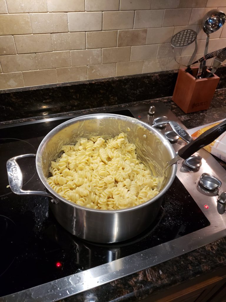 adding pasta